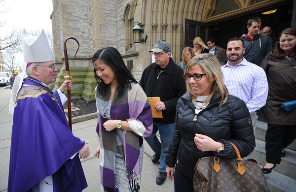Bishop Richard J. Malone greets parishioners after Ash Wednesday Mass at St. Joseph Cathedral. (Dan Cappellazzo/Staff Photographer)